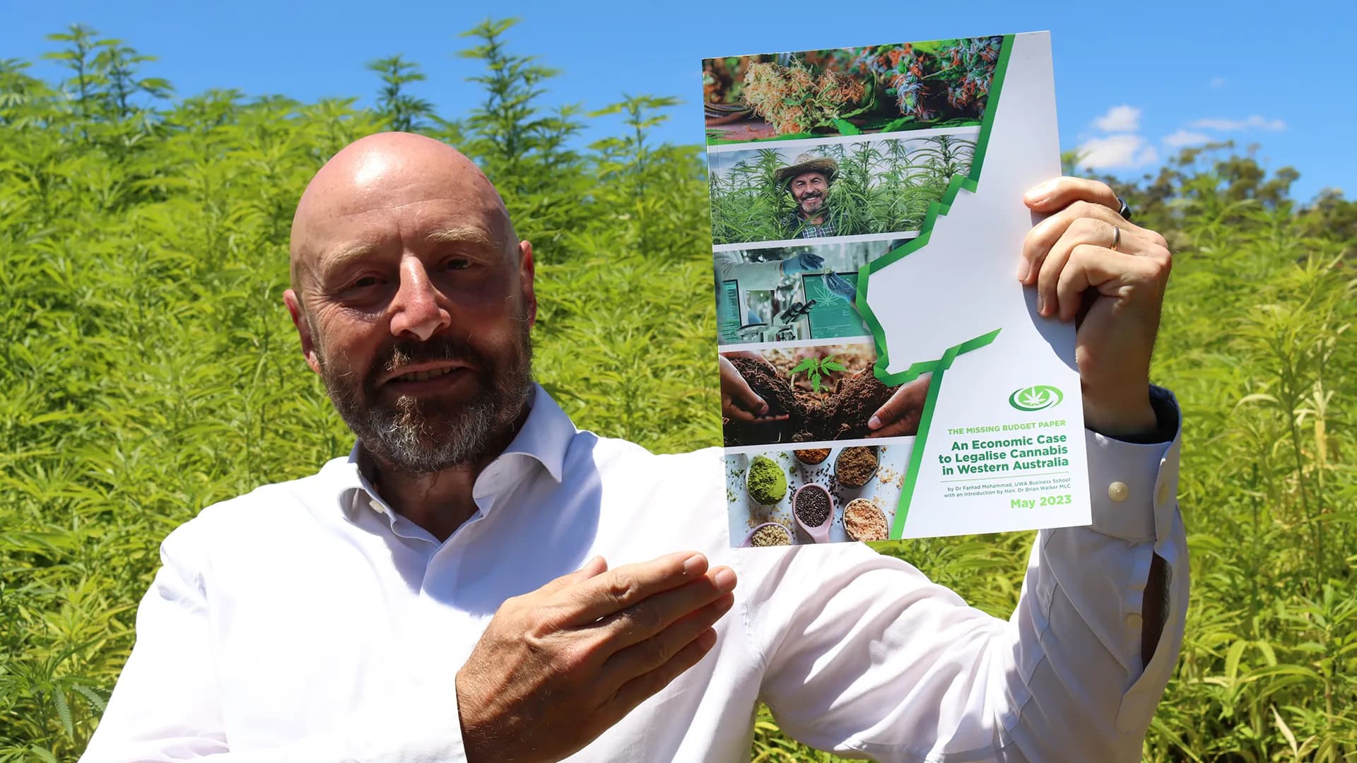 Dr Brian Walker holding the Economic Case Report